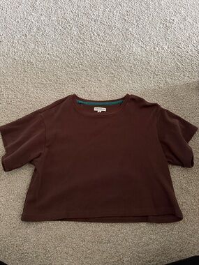 EARTHBOUND Dark Brown Tee with Teal Neck Trim
